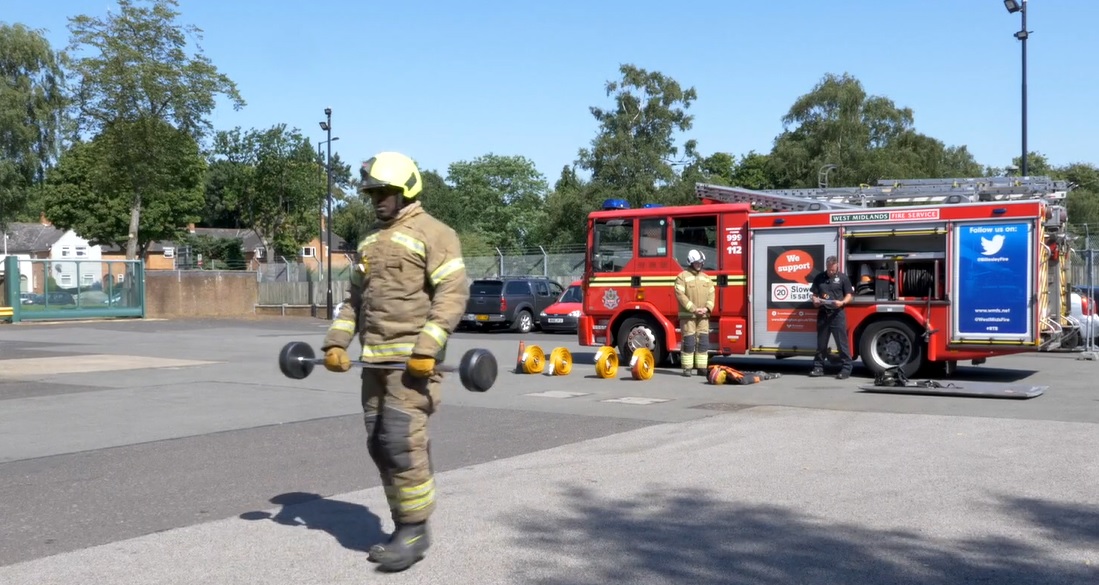 Firefighter carrying weight as part of firefighter fitness assessment 
